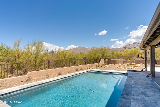 6261 N Placita De Rojelio, Tucson, AZ 85718 - view of swimming pool featuring a mountain view, a fenced backyard, and a patio