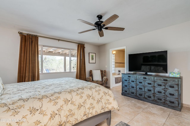 6261 N Placita De Rojelio, Tucson, AZ 85718 - bedroom with light tile patterned floors, ceiling fan, and ensuite bathroom