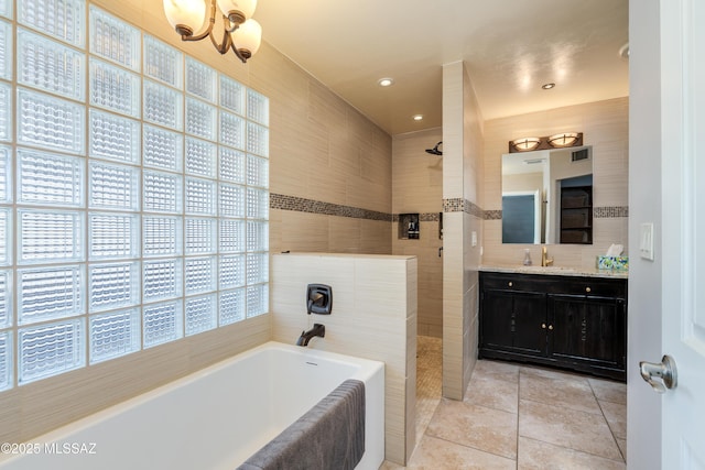 6261 N Placita De Rojelio, Tucson, AZ 85718 - full bathroom with walk in shower, a bath, tile walls, vanity, and tile patterned floors