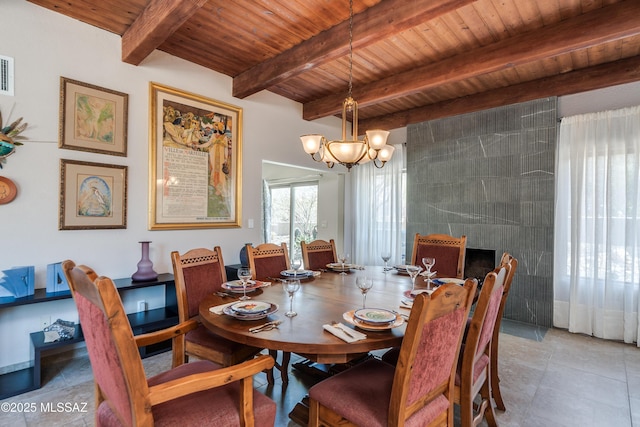 6261 N Placita De Rojelio, Tucson, AZ 85718 - dining space with wood ceiling, beam ceiling, tile patterned floors, and a chandelier