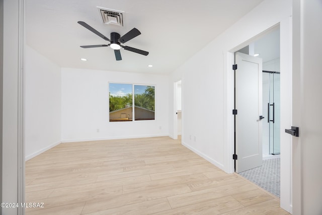 empty room featuring visible vents, baseboards, recessed lighting, a ceiling fan, and light wood-style flooring