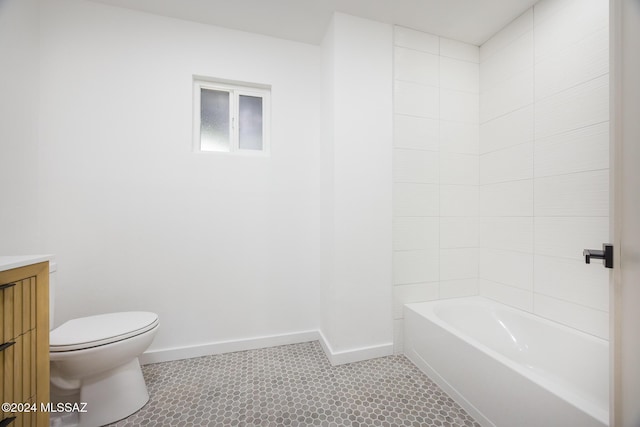 full bath with toilet, baseboards, tile patterned floors, and vanity