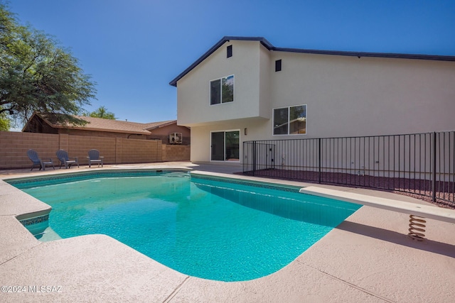 view of swimming pool with a patio, a fenced backyard, and a fenced in pool