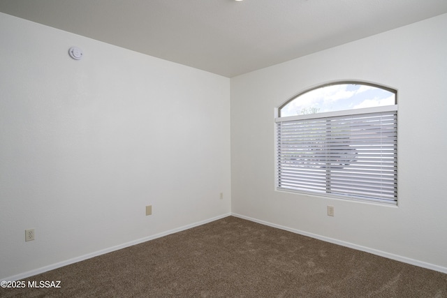 2414 E Calle Lena Verde, Tucson, AZ 85706 - unfurnished room with dark carpet and baseboards