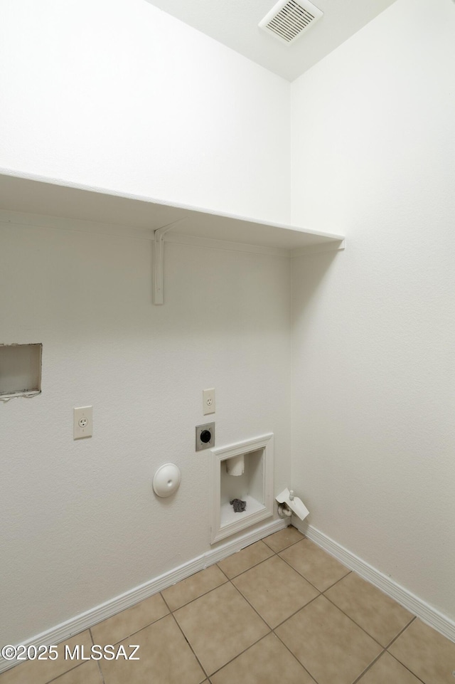 2414 E Calle Lena Verde, Tucson, AZ 85706 - washroom with baseboards, electric dryer hookup, hookup for a gas dryer, light tile patterned floors, and hookup for a washing machine