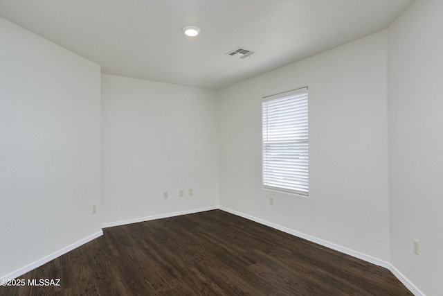 2414 E Calle Lena Verde, Tucson, AZ 85706 - unfurnished room featuring dark wood-style floors and baseboards