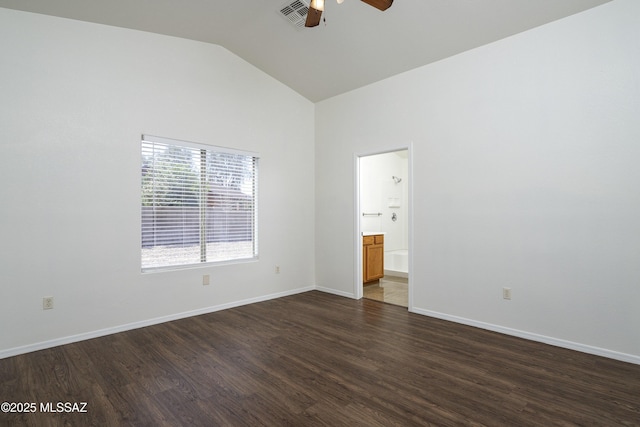 2414 E Calle Lena Verde, Tucson, AZ 85706 - spare room featuring a ceiling fan, vaulted ceiling, dark wood-style floors, and baseboards