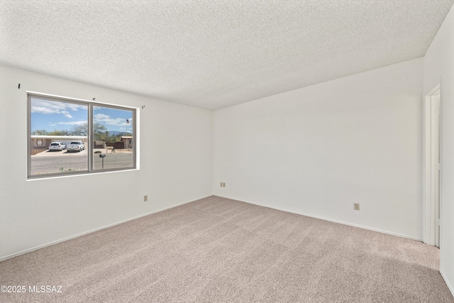 9770 E Hollow Pl, Tucson, AZ 85748 - carpeted spare room with a textured ceiling and baseboards