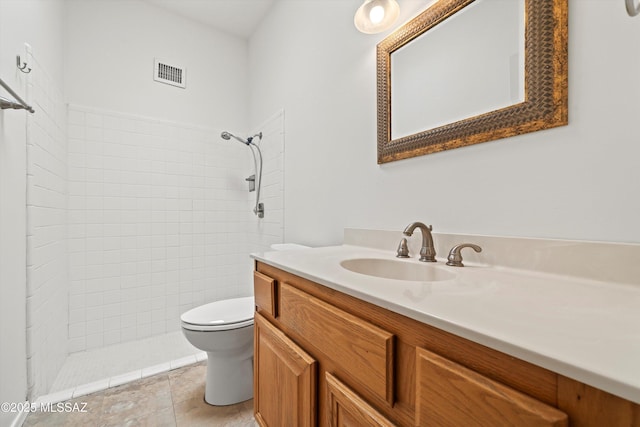 9770 E Hollow Pl, Tucson, AZ 85748 - full bath with tiled shower, visible vents, vanity, and toilet