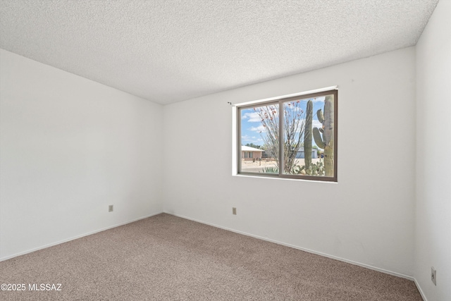 9770 E Hollow Pl, Tucson, AZ 85748 - carpeted empty room featuring baseboards and a textured ceiling