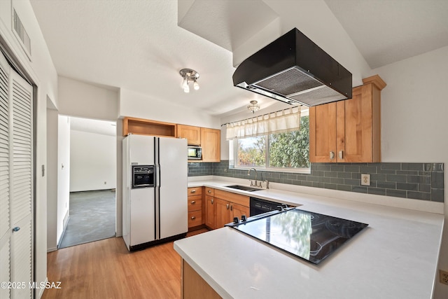 9770 E Hollow Pl, Tucson, AZ 85748 - kitchen with light wood-style flooring, a sink, stainless steel microwave, decorative backsplash, and white refrigerator with ice dispenser