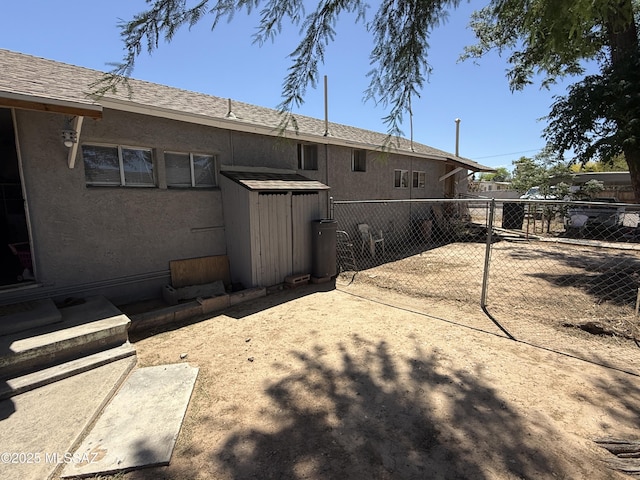 276 E Pastime Rd, Tucson, AZ 85705 - rear view of property with fence and stucco siding