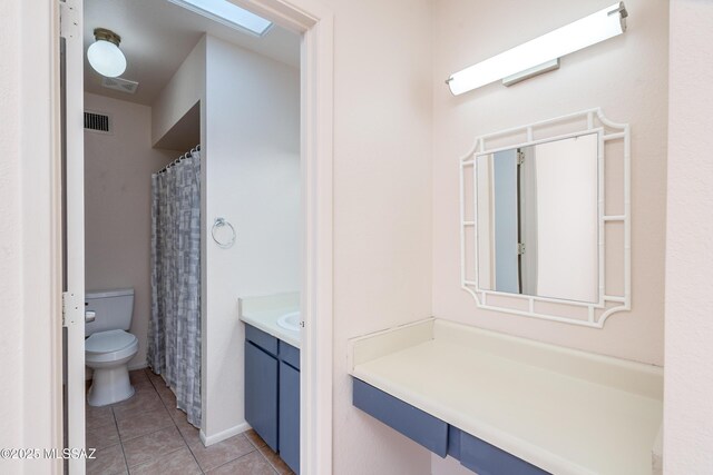 full bath featuring toilet, vanity, tile patterned floors, and visible vents