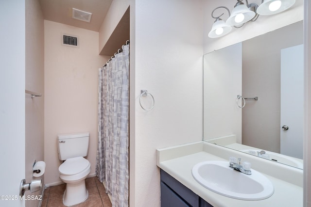 bathroom with visible vents, tile patterned flooring, vanity, and toilet