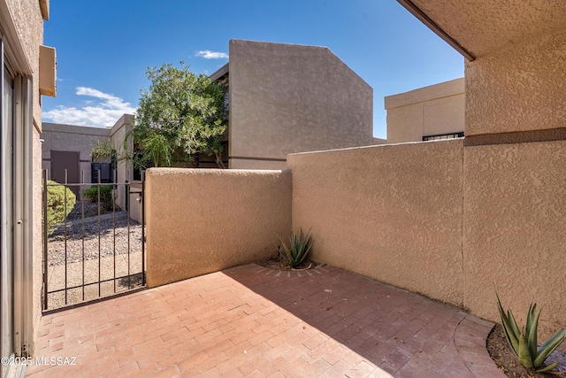 view of patio / terrace with a gate and fence