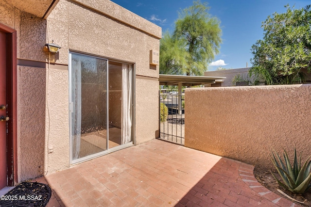 view of patio / terrace with a gate