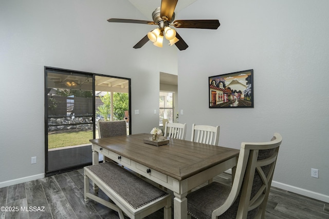 9810 E Amaroso Ln, Tucson, AZ 85748 - dining area featuring baseboards, wood finished floors, ceiling fan, and a high ceiling