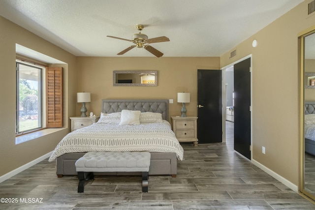 9810 E Amaroso Ln, Tucson, AZ 85748 - bedroom featuring baseboards, visible vents, and wood finished floors