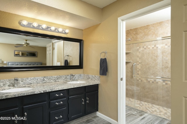9810 E Amaroso Ln, Tucson, AZ 85748 - full bath with double vanity, a stall shower, and a sink