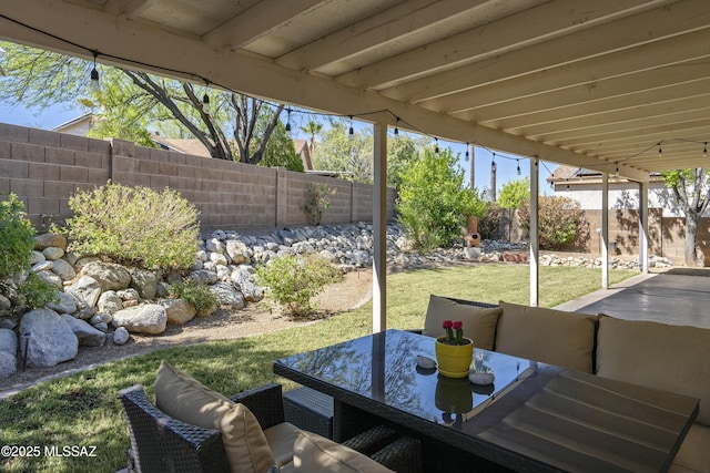 9810 E Amaroso Ln, Tucson, AZ 85748 - view of patio with outdoor dining space and a fenced backyard
