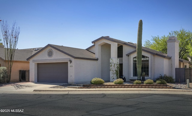 9810 E Amaroso Ln, Tucson, AZ 85748 - mid-century home with stucco siding, driveway, a chimney, and a garage