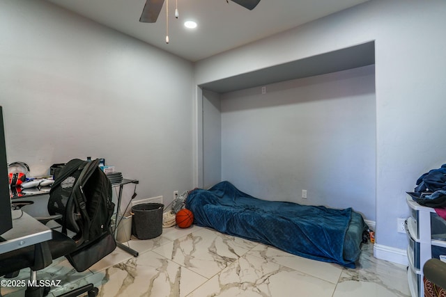 bedroom with marble finish floor and ceiling fan