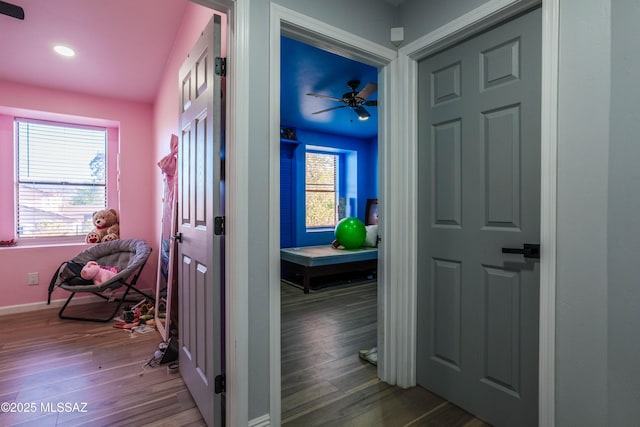 interior space featuring recessed lighting, wood finished floors, and baseboards