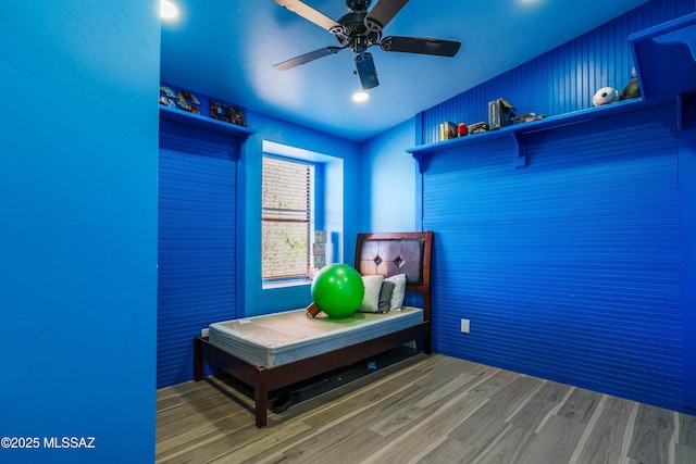 bedroom featuring a ceiling fan and wood finished floors