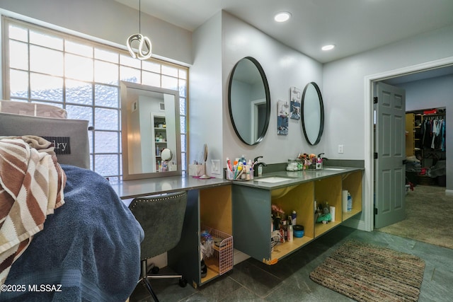 full bath featuring recessed lighting, double vanity, and a sink