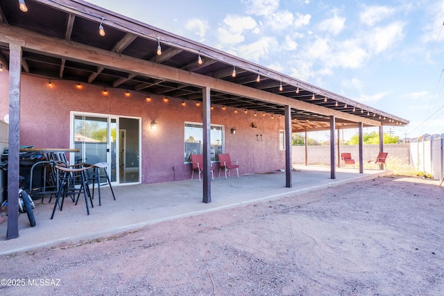 view of patio / terrace featuring fence