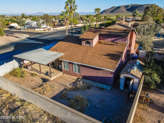 aerial view with a mountain view and a residential view