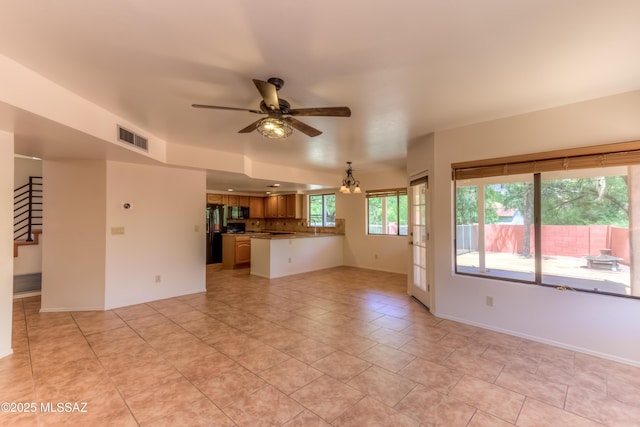 5476 N Indian Trl, Tucson, AZ 85750 - unfurnished living room with a ceiling fan, visible vents, and light tile patterned floors