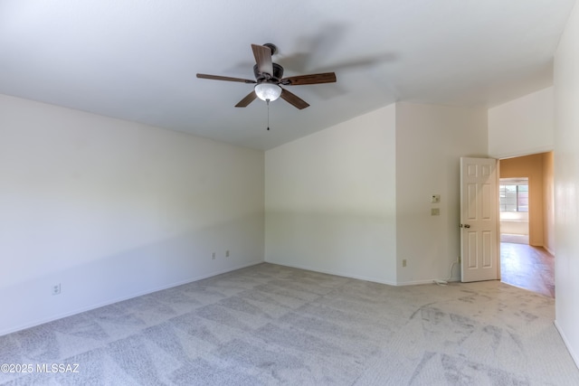 5476 N Indian Trl, Tucson, AZ 85750 - spare room featuring vaulted ceiling, ceiling fan, baseboards, and light carpet