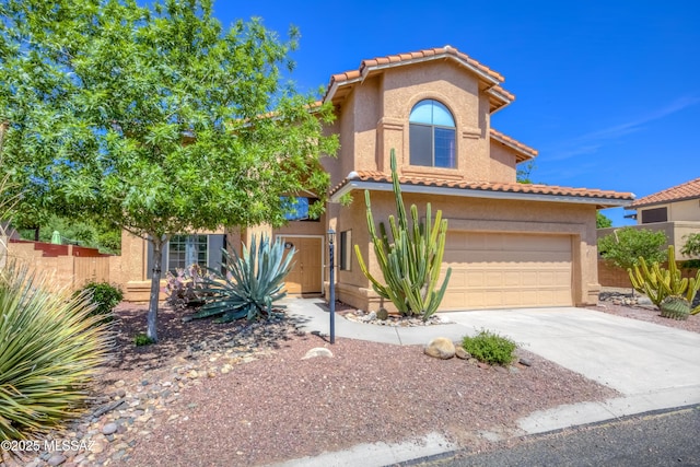 5476 N Indian Trl, Tucson, AZ 85750 - mediterranean / spanish home featuring concrete driveway, a tiled roof, fence, and stucco siding