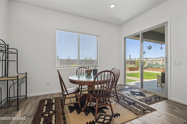 dining area with wood finished floors, recessed lighting, and baseboards