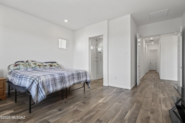 bedroom with wood finished floors, visible vents, recessed lighting, and baseboards