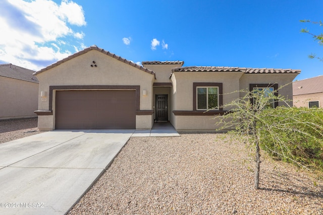 491 W Camino Del Toro, Vail, AZ 85641 - mediterranean / spanish-style home with a garage, driveway, stucco siding, and a tiled roof