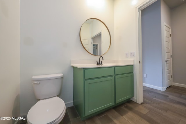 491 W Camino Del Toro, Vail, AZ 85641 - bathroom featuring vanity, wood finished floors, toilet, and baseboards
