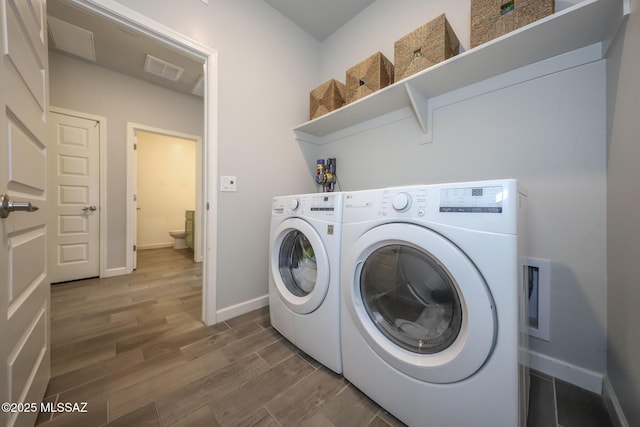 491 W Camino Del Toro, Vail, AZ 85641 - washroom featuring washing machine and clothes dryer, wood finished floors, and baseboards