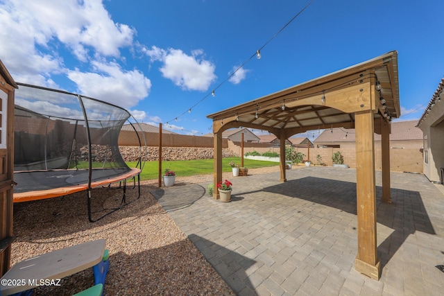 491 W Camino Del Toro, Vail, AZ 85641 - fenced backyard featuring a trampoline, a patio, and a gazebo