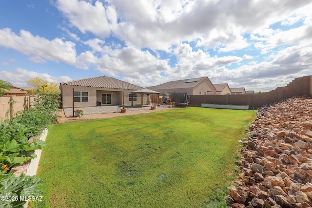 491 W Camino Del Toro, Vail, AZ 85641 - view of yard featuring a gazebo, a trampoline, and a patio area