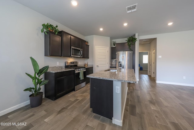 491 W Camino Del Toro, Vail, AZ 85641 - kitchen featuring stainless steel appliances, light wood-type flooring, baseboards, and recessed lighting