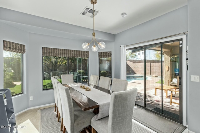 10658 E Rose Hill St, Tucson, AZ 85747 - dining room with visible vents, a wealth of natural light, and an inviting chandelier
