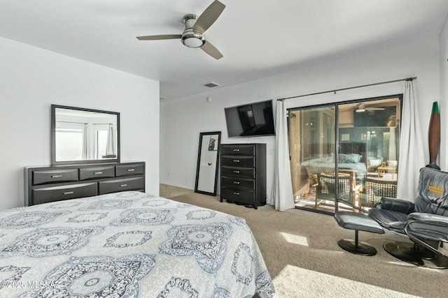 10658 E Rose Hill St, Tucson, AZ 85747 - carpeted bedroom with a ceiling fan, visible vents, and access to outside
