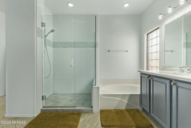 10658 E Rose Hill St, Tucson, AZ 85747 - full bathroom featuring recessed lighting, a garden tub, vanity, and a stall shower