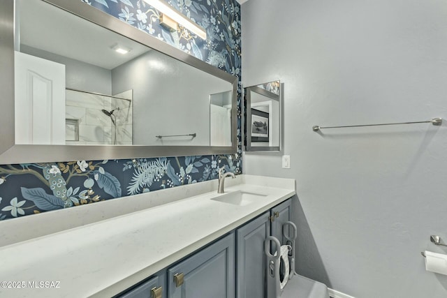 10658 E Rose Hill St, Tucson, AZ 85747 - bathroom featuring baseboards, wallpapered walls, walk in shower, and vanity