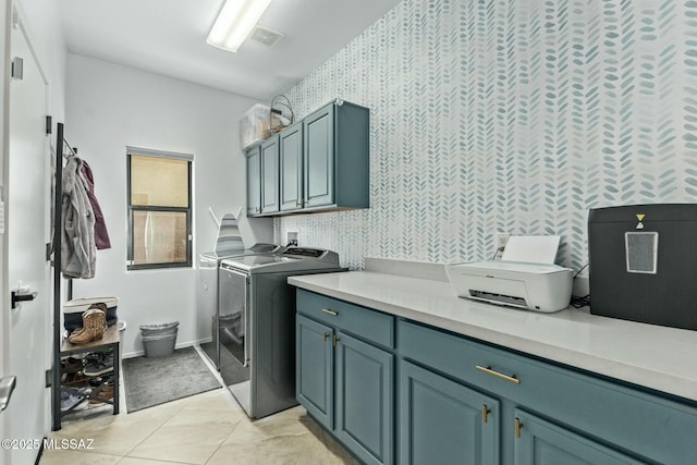 10658 E Rose Hill St, Tucson, AZ 85747 - washroom with wallpapered walls, washer and clothes dryer, light tile patterned flooring, baseboards, and cabinet space