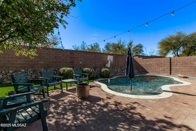 10658 E Rose Hill St, Tucson, AZ 85747 - view of pool with a patio area, a fenced in pool, and a fenced backyard