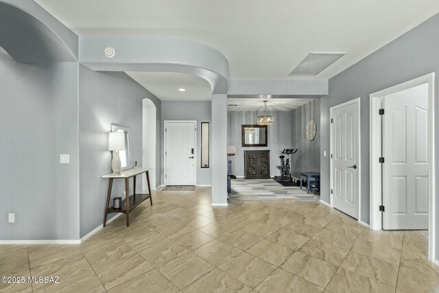10658 E Rose Hill St, Tucson, AZ 85747 - entryway featuring arched walkways, baseboards, and recessed lighting