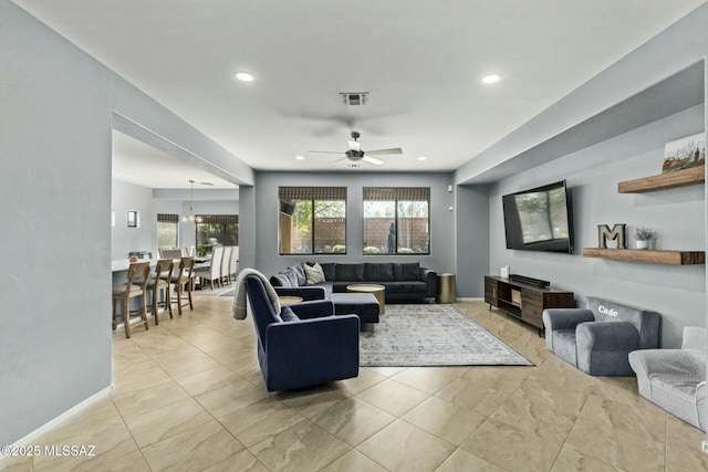 10658 E Rose Hill St, Tucson, AZ 85747 - living room with a ceiling fan, a healthy amount of sunlight, visible vents, and recessed lighting
